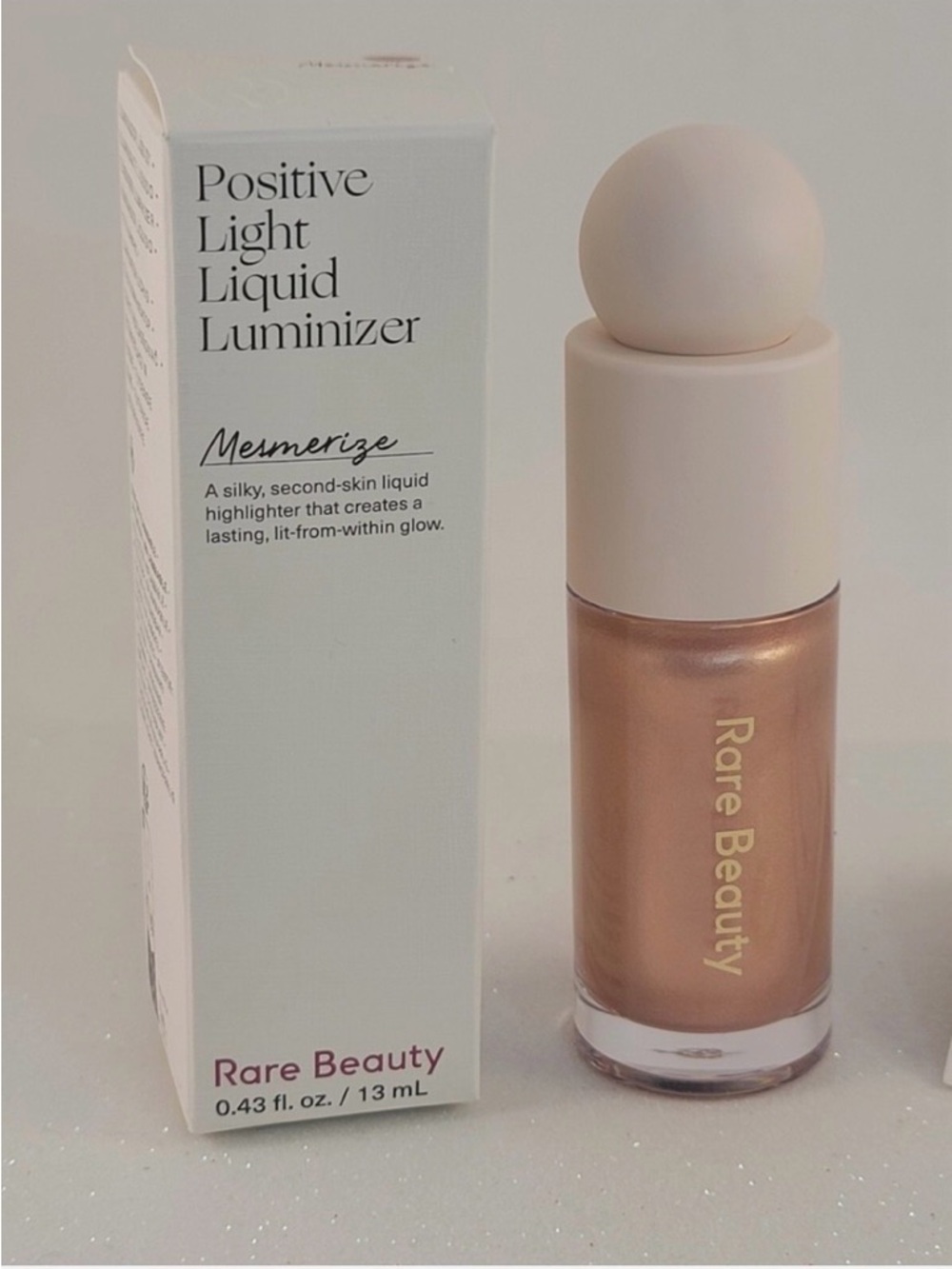 Rare Beauty Positive Light Liquid Luminizer — Mesmerize (champagne bronze)